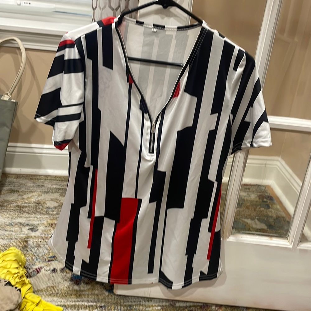 Black/white polyester t shirt with a partial zipper down the bust